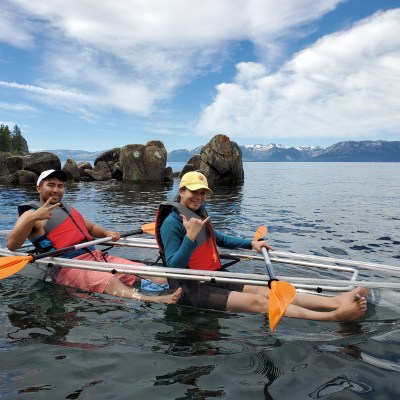 two people on clear kayak