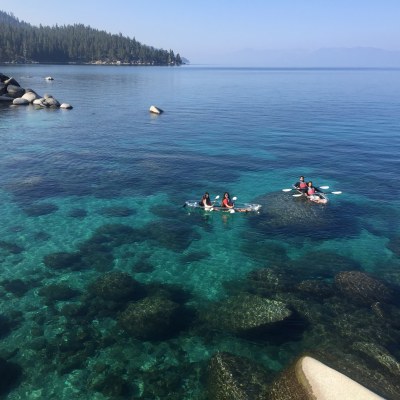 people clearly enjoying an adventure in clear kayaks on lake tahoe nevada state park